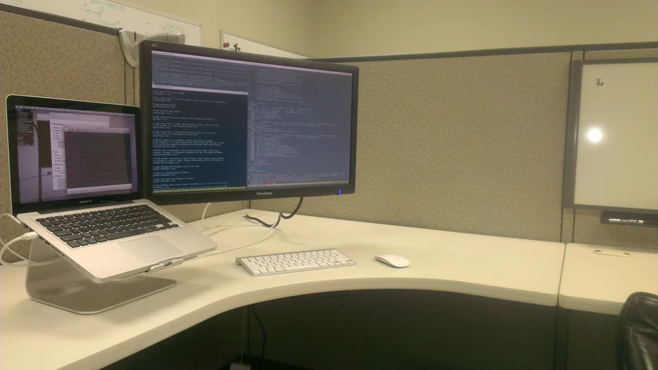 Terminals in a beige cubicle.